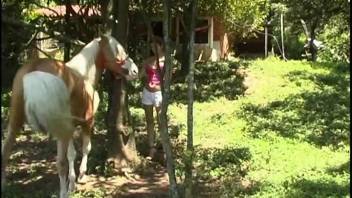 Busty beauty eagerly devours a semen-filled equine cock with enthusiasm