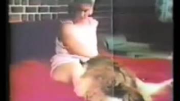 Classic footage of a female bestiality enthusiast performing oral sex on a horse