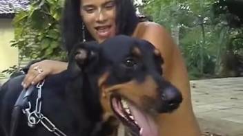 Dark-haired woman with a plump rear mounting a canine member