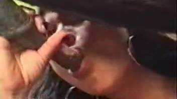 Hispanic woman giving head to a hung guy's dick outside